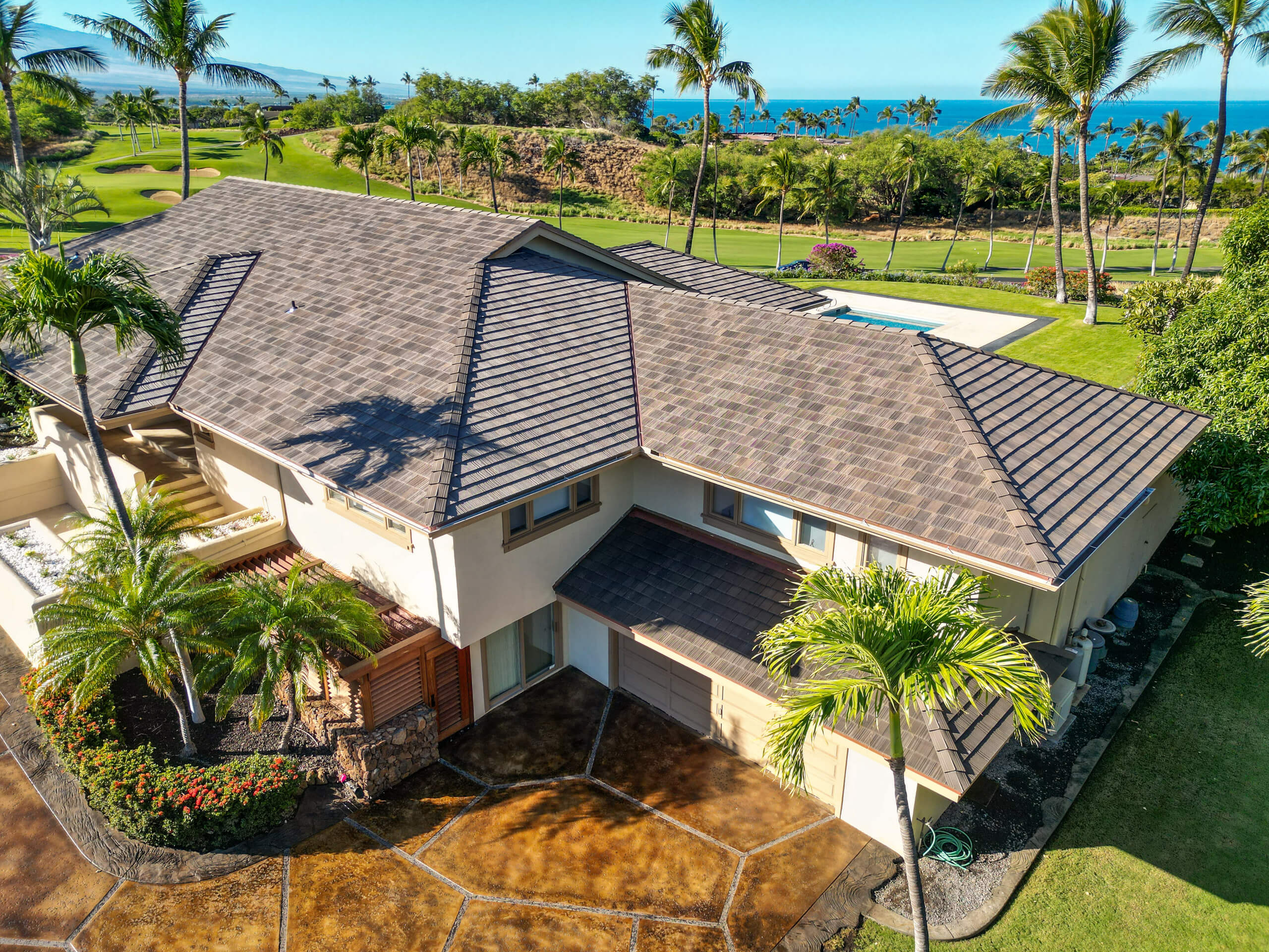 A beautiful aerial shot of cedar roofing work done on a home by Kokua Roofing.