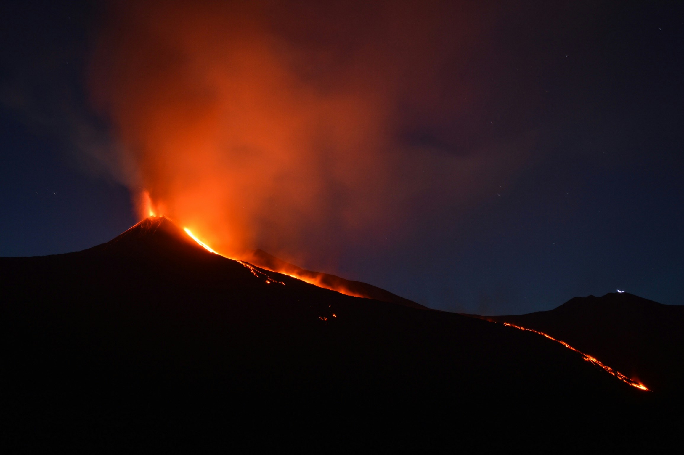 A photo of a volcano erupting.
