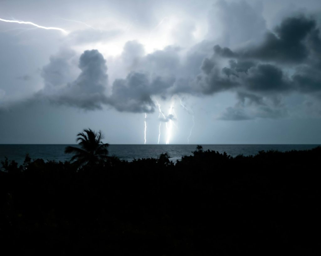 A photo of a serious storm with lightning and clouds.