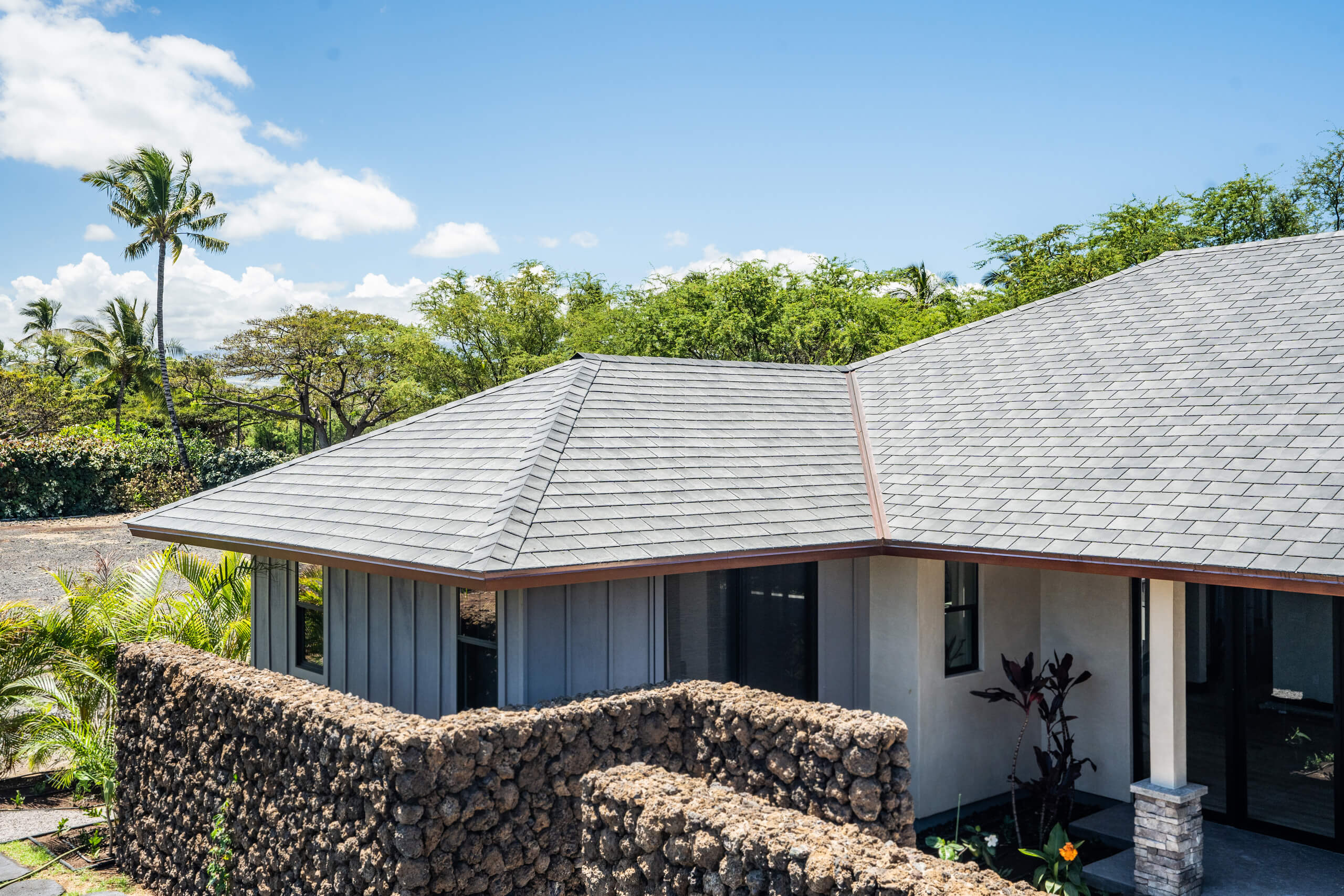 A professional image of slate roofing work done on a home by Kokua Roofing.